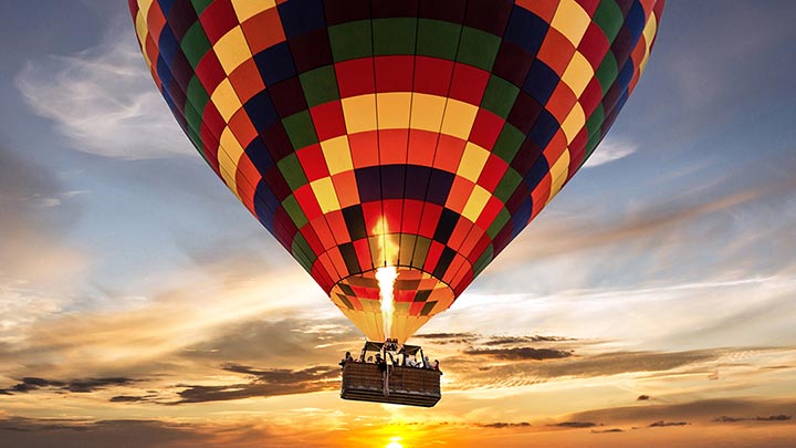 Hot air balloon flight at sunrise